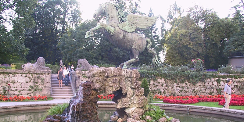 Mirabell Gardens with the fortress framed through the flowerbeds