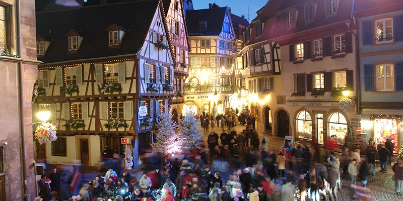 Evening crowds among the Christmas lights of Colmar