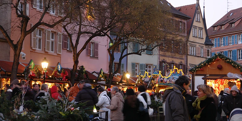 Christmas market stalls under the trees in Colmar