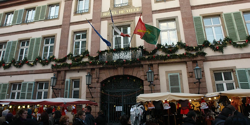 Crowds at a decorated Christmas market square in Colmar
