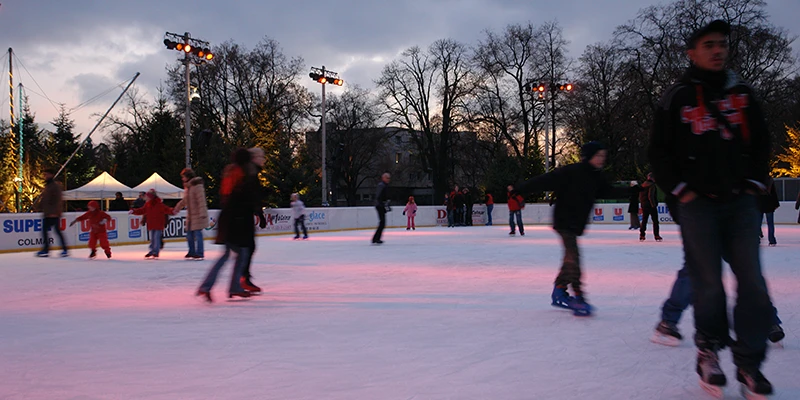 Ice skating rink at dusk during the Colmar Christmas season