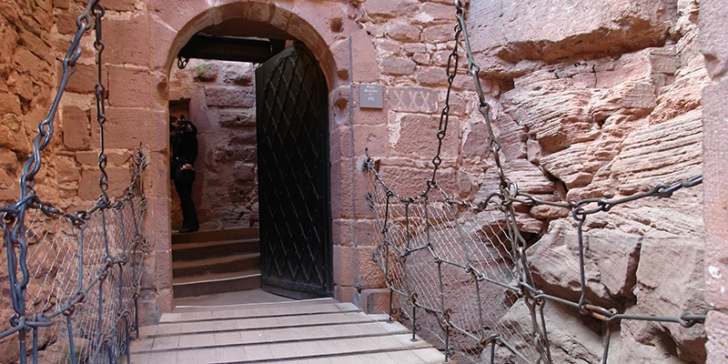 Stone staircase cut through the rock inside Haut-Koenigsbourg