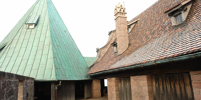 Green copper roof of an outbuilding in a courtyard at Haut-Koenigsbourg