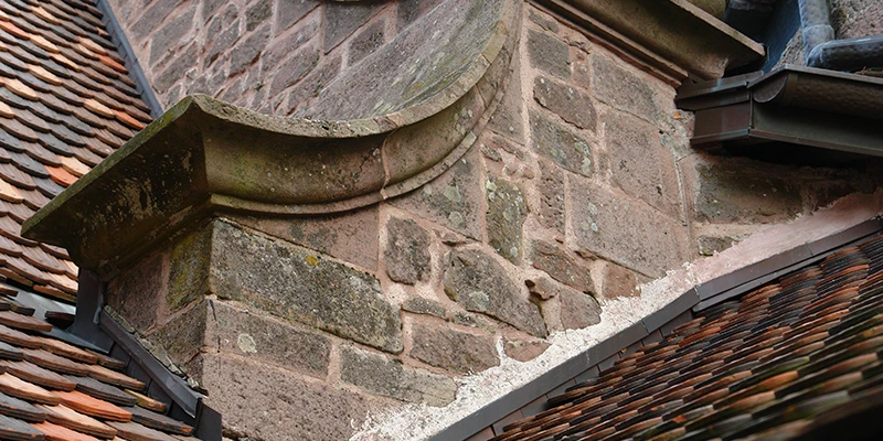 Detail of tiled roofs and carved sandstone at Haut-Koenigsbourg