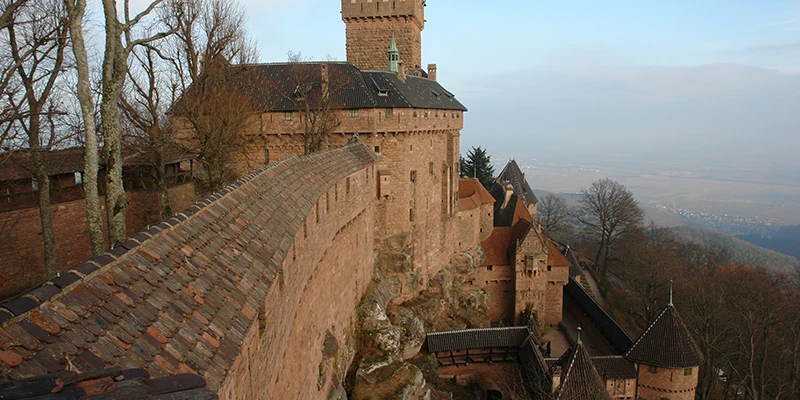 The walls of Haut-Koenigsbourg at dusk with the plain beyond