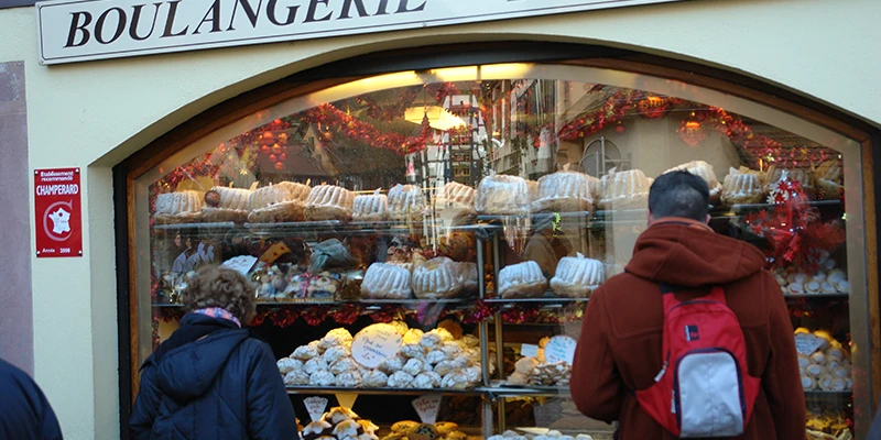 Bakery window in Kaysersberg filled with pastries and breads during the Christmas market
