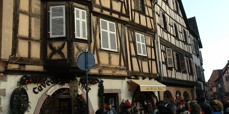 Historic half-timbered buildings lining the pedestrian lane through Kaysersberg