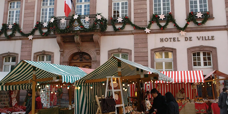 The Hôtel de Ville in Ribeauvillé with Christmas market stalls set up in front