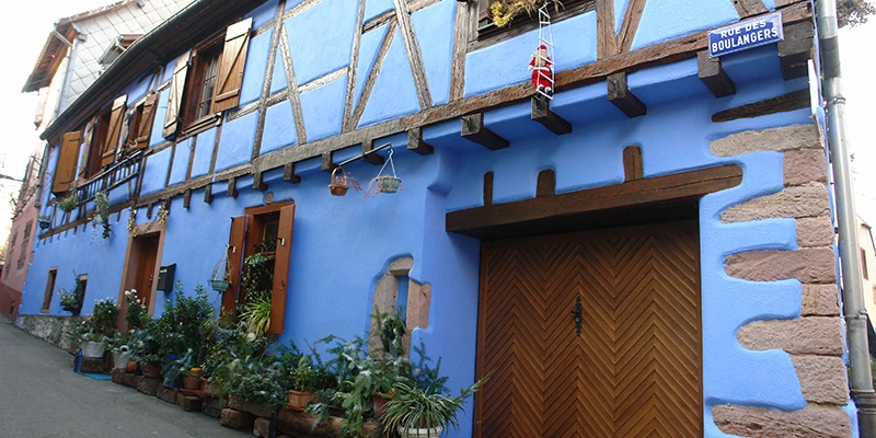 Blue painted house with timber framing in a Ribeauvillé side street