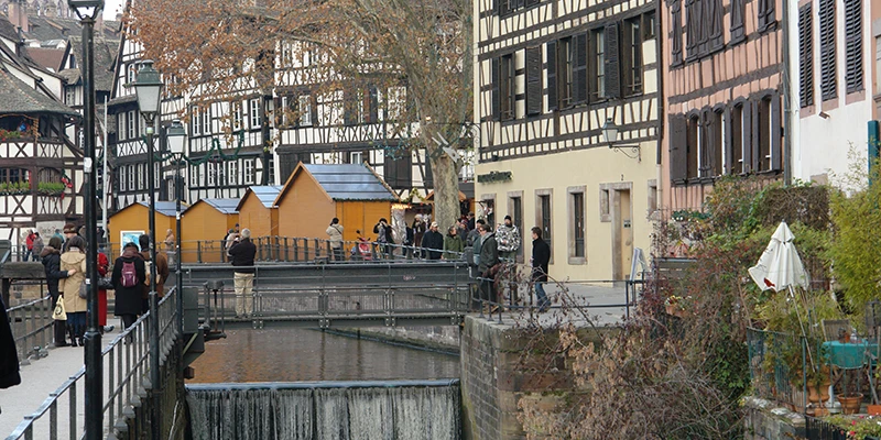 Market stalls beside a canal in Strasbourg