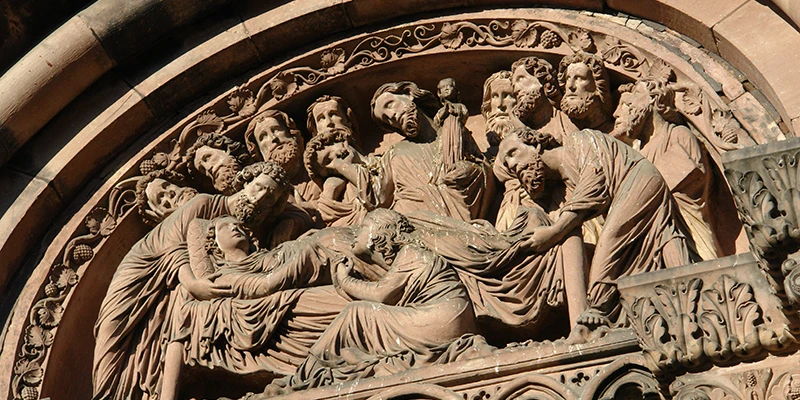 Carved tympanum relief above a portal of Strasbourg Cathedral