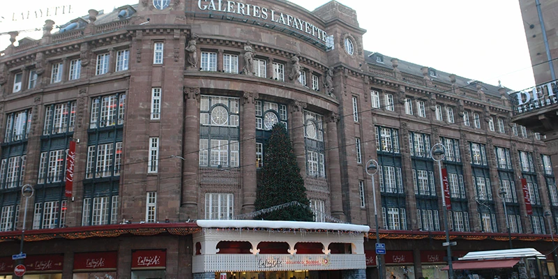 A grand sandstone building with a statue in front, Strasbourg