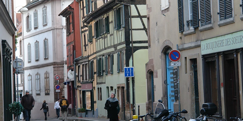 Half-timbered buildings lining a quiet street in Strasbourg