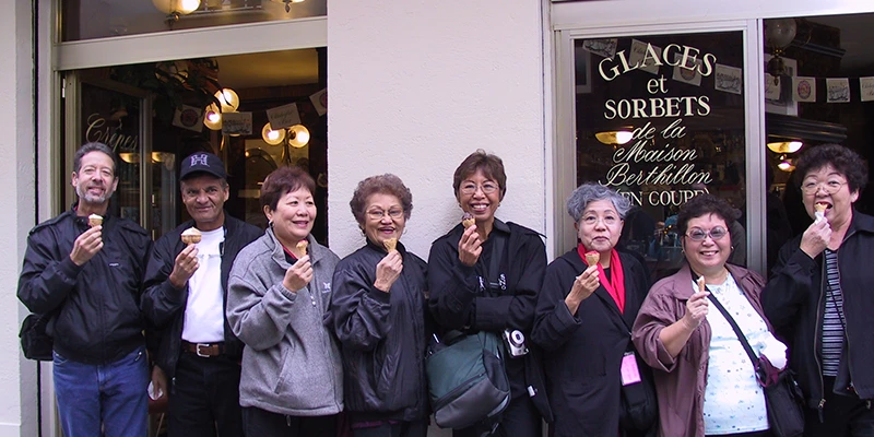 Visitors with Berthillon ice cream cones on the Île Saint-Louis, Paris