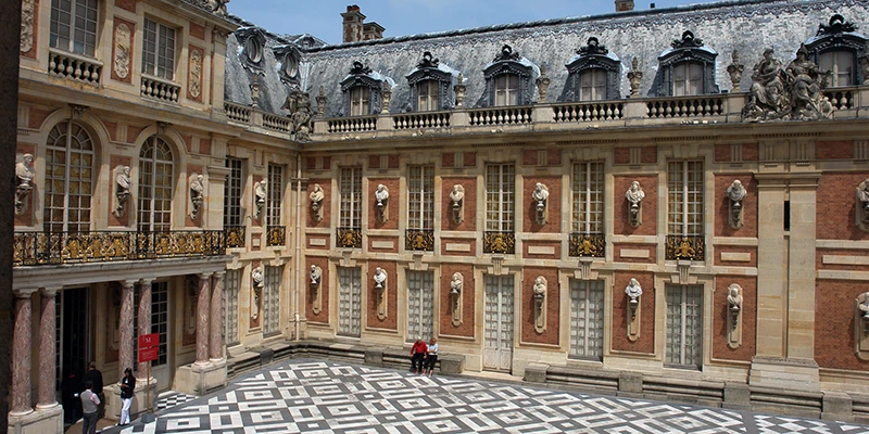 The marble forecourt of the Palace of Versailles