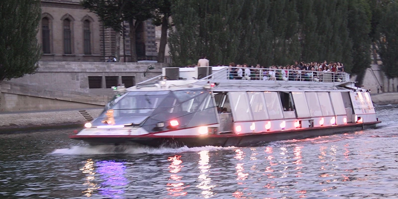 A sightseeing boat on the Seine at dusk, Paris