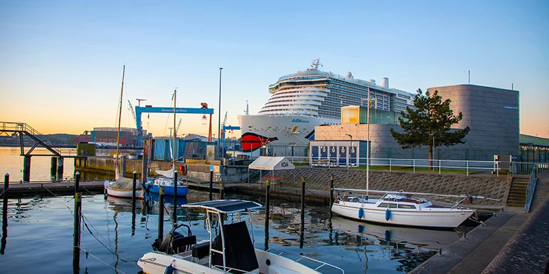 busy harbor with cruise ship