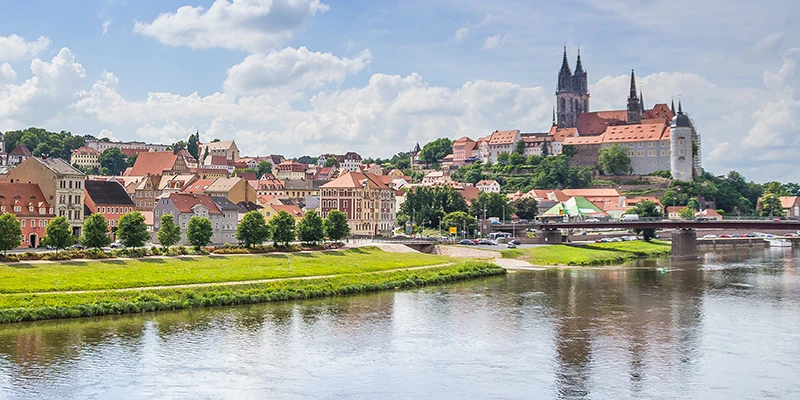 The Meissen skyline seen from across the Elbe in summer, castle and cathedral above the town