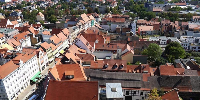 Aerial view over Naumburg's old-town rooftops and a shopping street