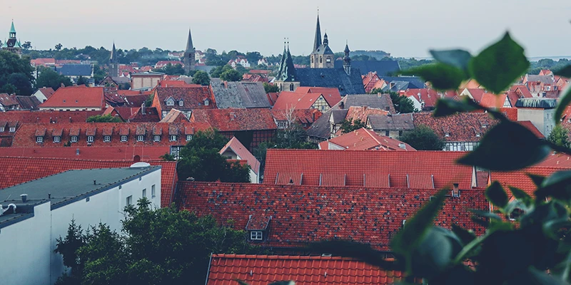 Quedlinburg rooftops and church spires seen from above at dusk