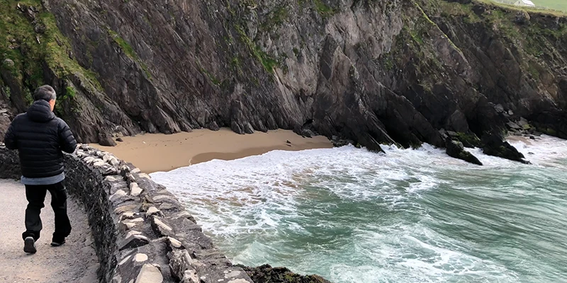 Coumeenoole Beach viewed from the cliff above the rocky shore