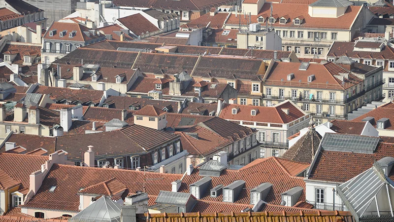 Lisbon rooftops running downhill toward the water