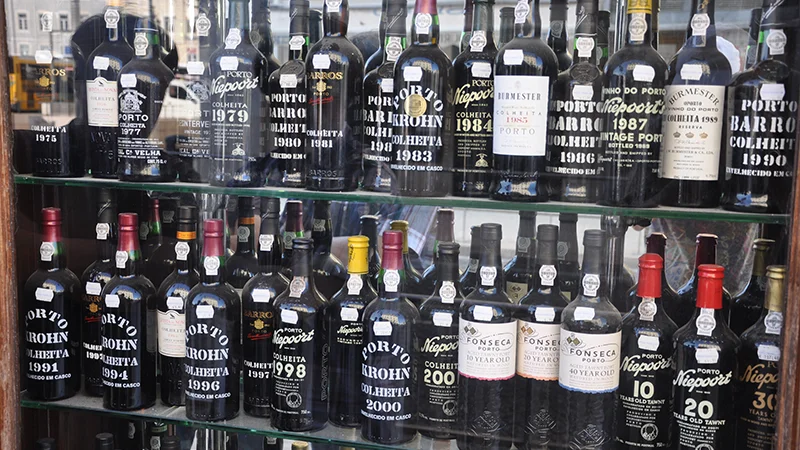Display of port wine bottles in a Lisbon shop window