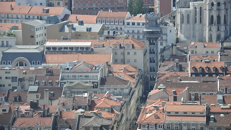Dense terracotta rooftops of Lisbon seen from above