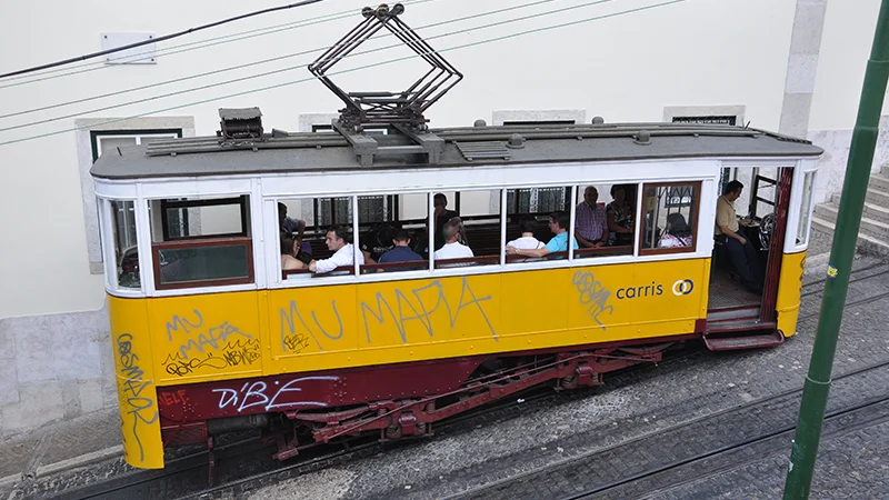 Yellow tram at the edge of the Bairro Alto district