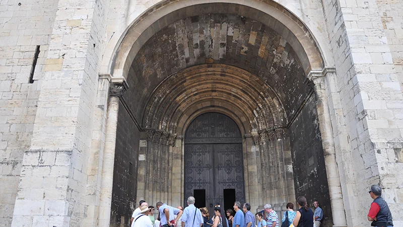 Portal of Lisbon Cathedral with visitors outside