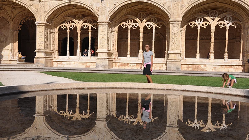 Jeronimos cloister with garden and reflections in the water