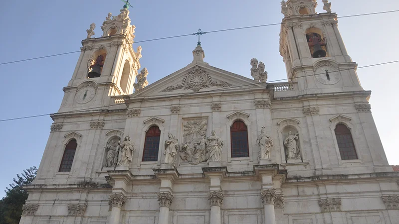 White baroque church with twin towers in Lisbon
