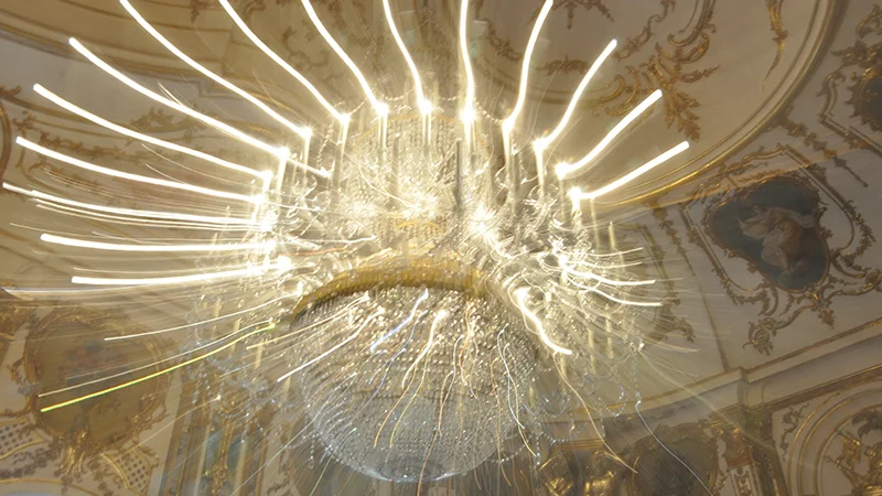 Gilded chandelier and painted ceiling at Queluz Palace
