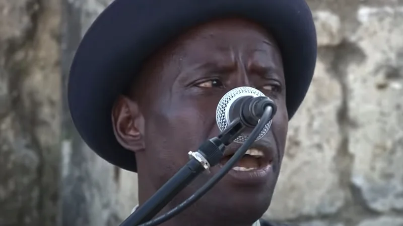 Street musician singing into a microphone in Lisbon