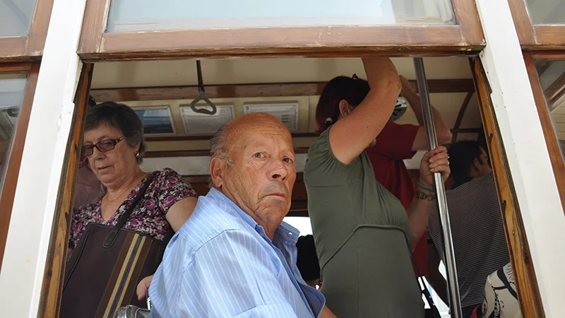 Passenger looking out of the window of a Lisbon tram