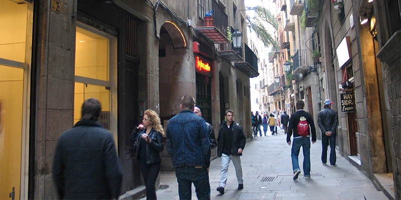 Narrow pedestrian lane with shops in La Ribera