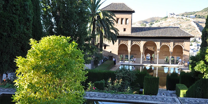 View across Granada toward the Alhambra and Sierra Nevada mountains