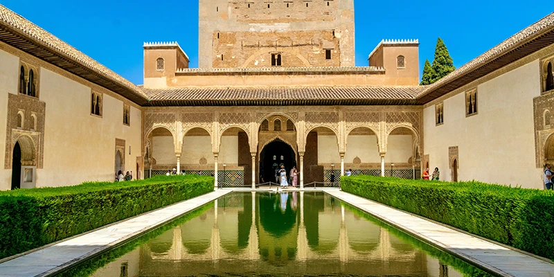 The Patio de los Comares reflecting pool mirroring the Torre de Comares
