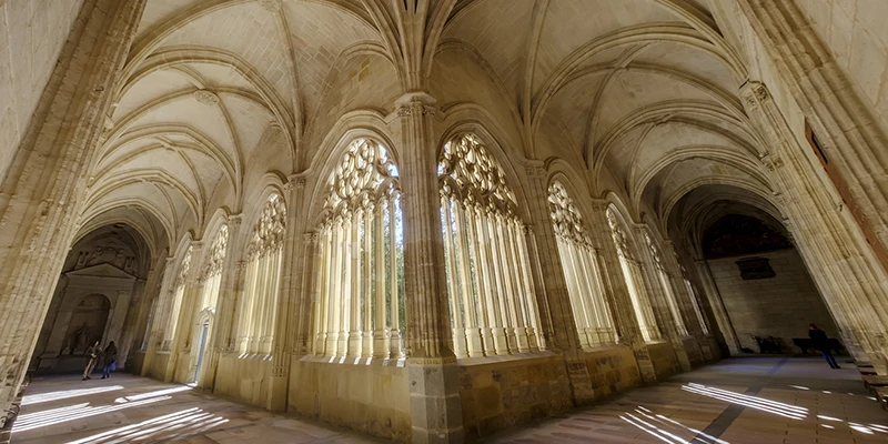 Interior view of the cathedral cloister showing elegant Gothic arches and stonework