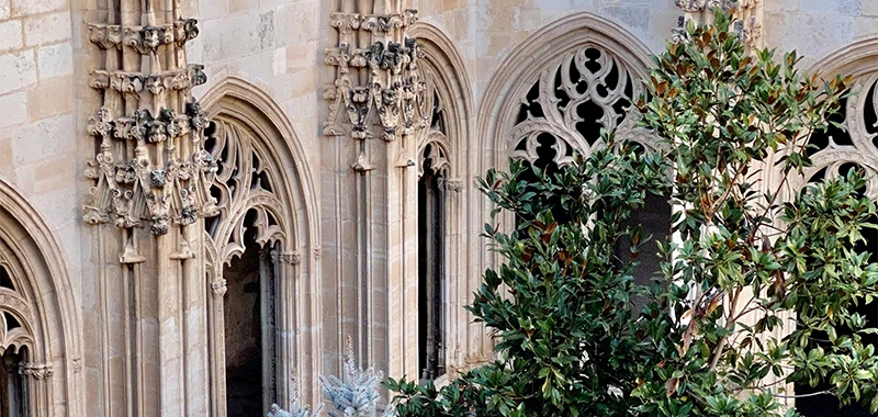 The two-story cloister of San Juan de los Reyes with arcaded levels and Mudéjar wooden ceilings