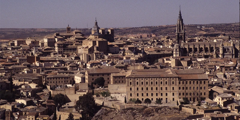 Mirador del Valle sunset view with cathedral and Alcázar glowing above the rooftops