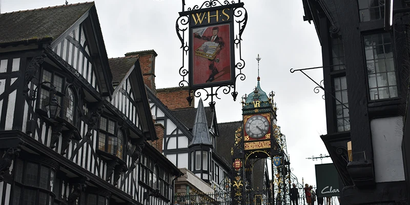 The Eastgate Clock in Chester rising above black-and-white timbered buildings