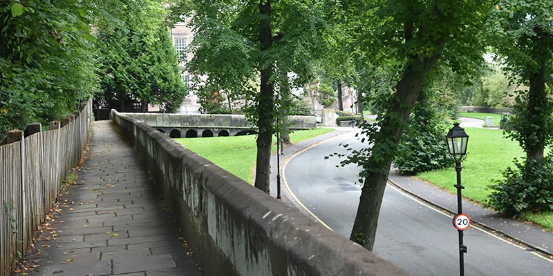 The canal below the Chester city walls, with towpath and lamp posts