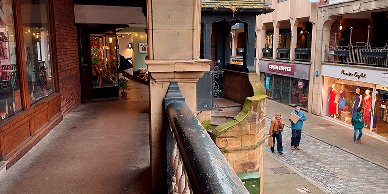 Looking out from inside a Rows gallery in Chester to the shops opposite