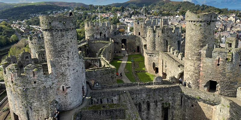 Conwy Castle from above, showing the town and the walls running up the hillside