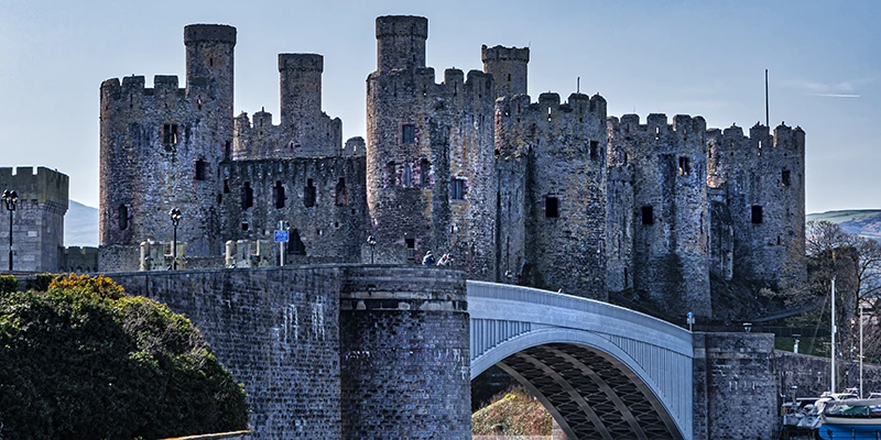 Conwy Castle with the arch of the bridge in front of it