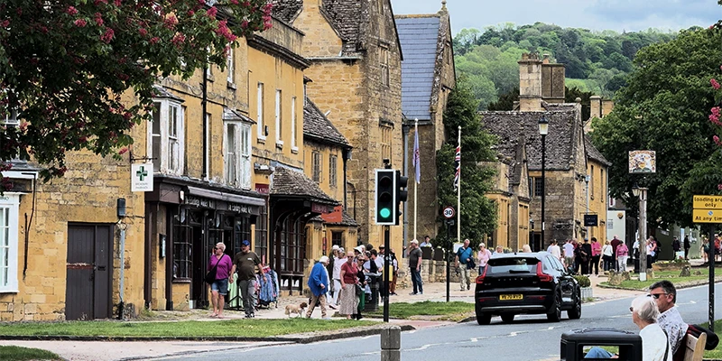 People waiting by road