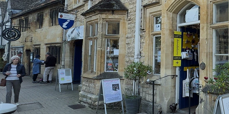 Visitor information center exterior with adjacent shops