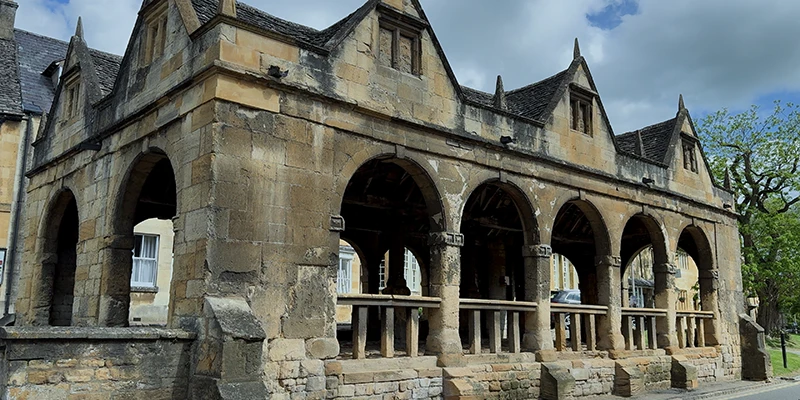 Market Hall side view showing stone arches and gabled roofline