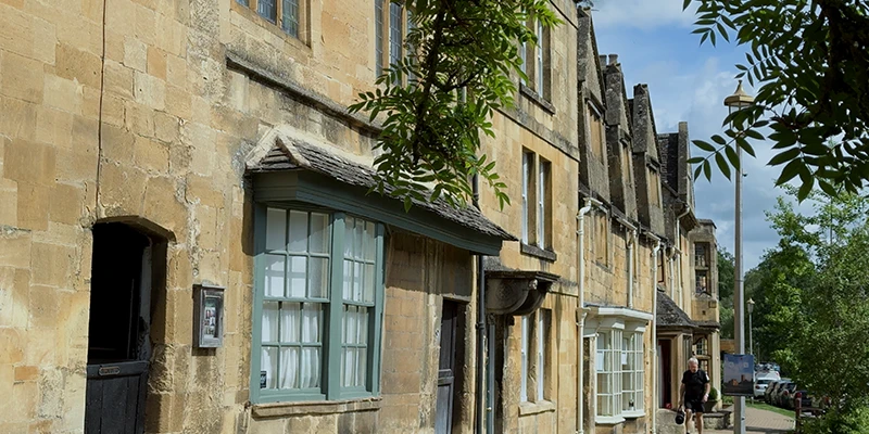 High Street row of honey-colored Cotswold stone buildings